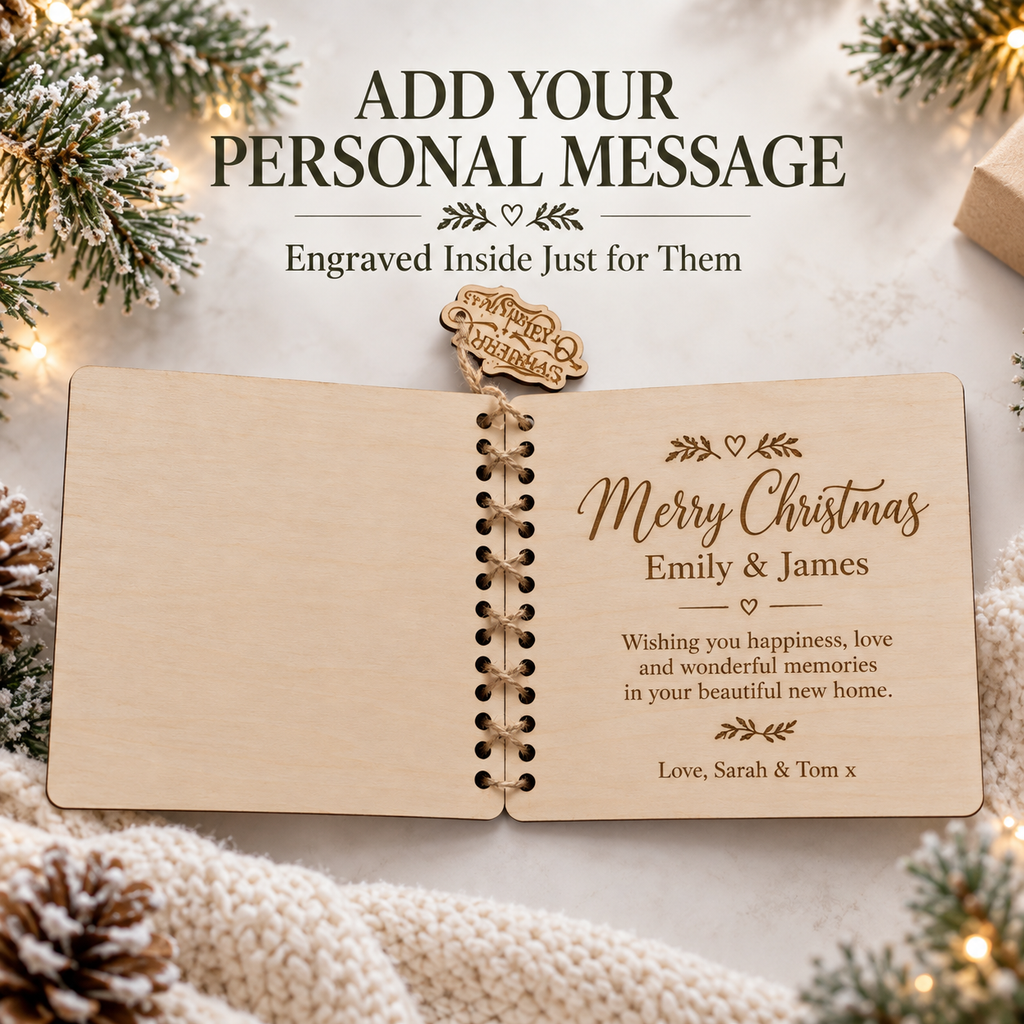 Open wooden Christmas card showing a personal message engraved inside, Merry Christmas with custom names and wishes for their new home