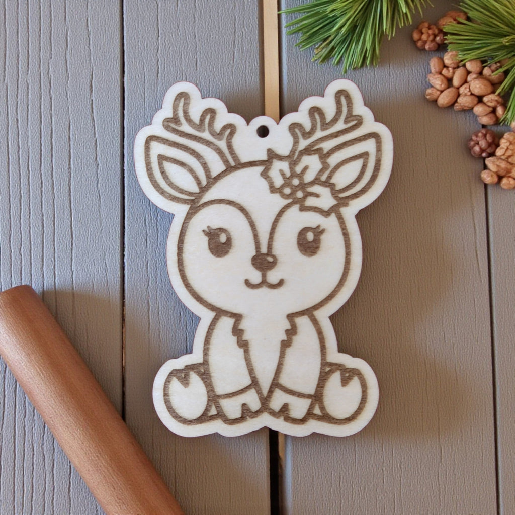 Girl reindeer wooden ornament with holly flower, adorable Christmas decor.