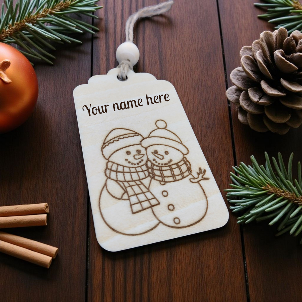 Engraved wooden snowman gift tag, personalised and ideal for adding a festive touch to Christmas gifts by CraftRay Gifts.