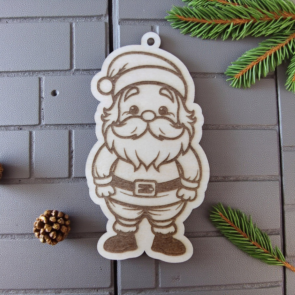 Santa Claus ornament with hat and beard, engraved on natural wood.