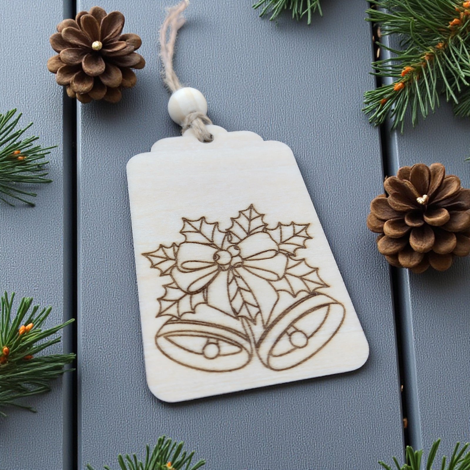 Engraved holly and bells wooden Christmas gift tag – rustic handmade tag by CraftRay Gifts.