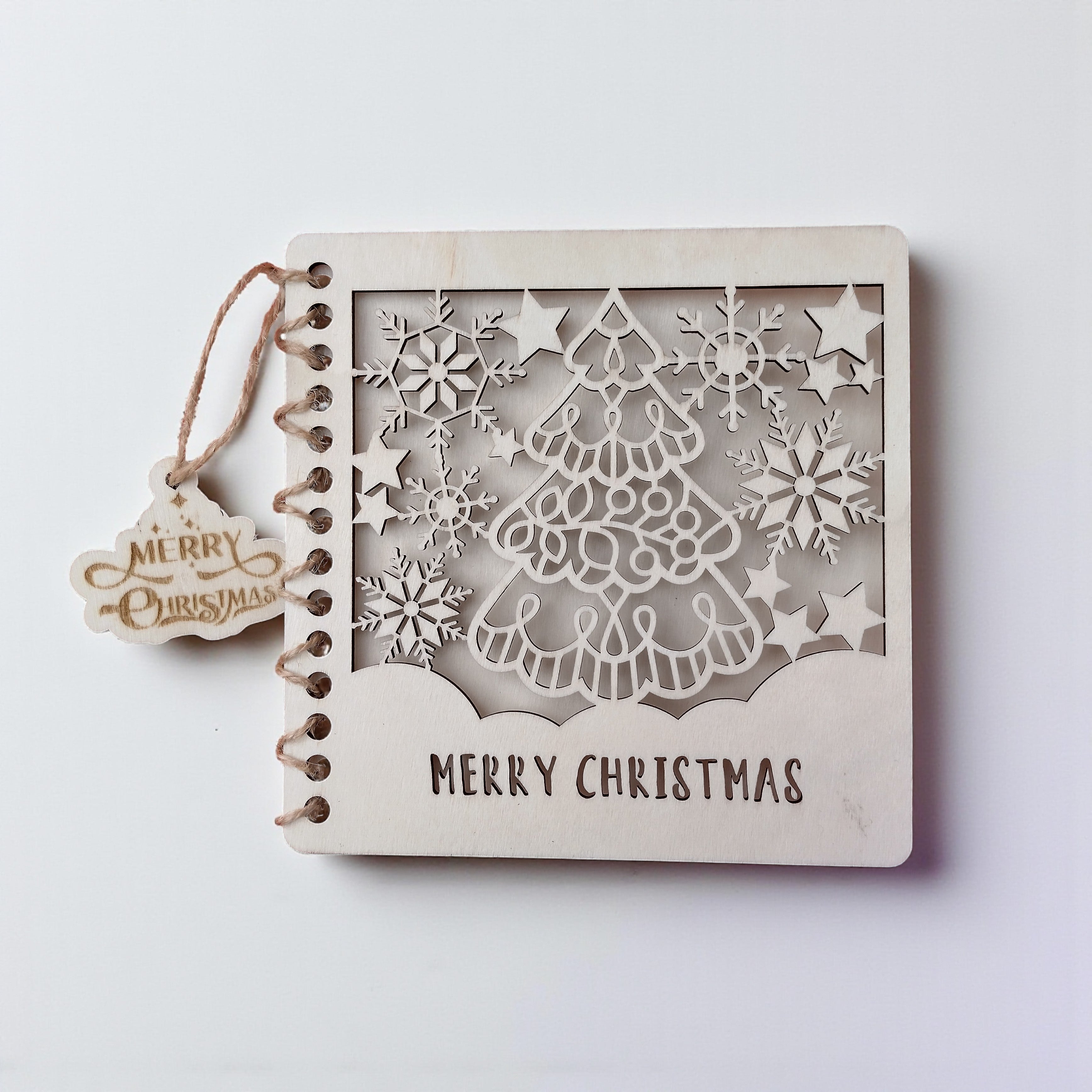 2️⃣ Laser-cut wooden card with Christmas tree – Merry Christmas engraved.
