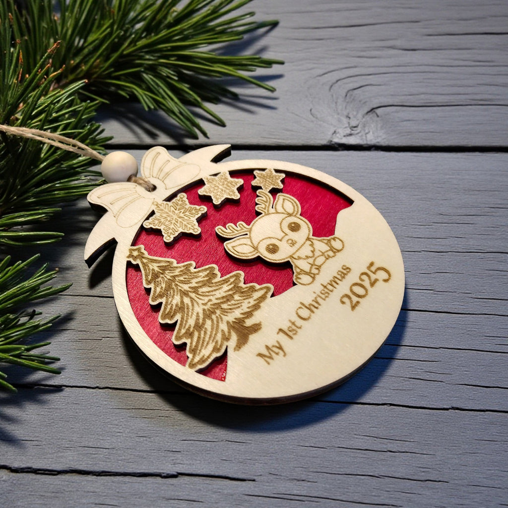 Personalised baby’s first Christmas wooden bauble with red background – CraftRay Gifts.