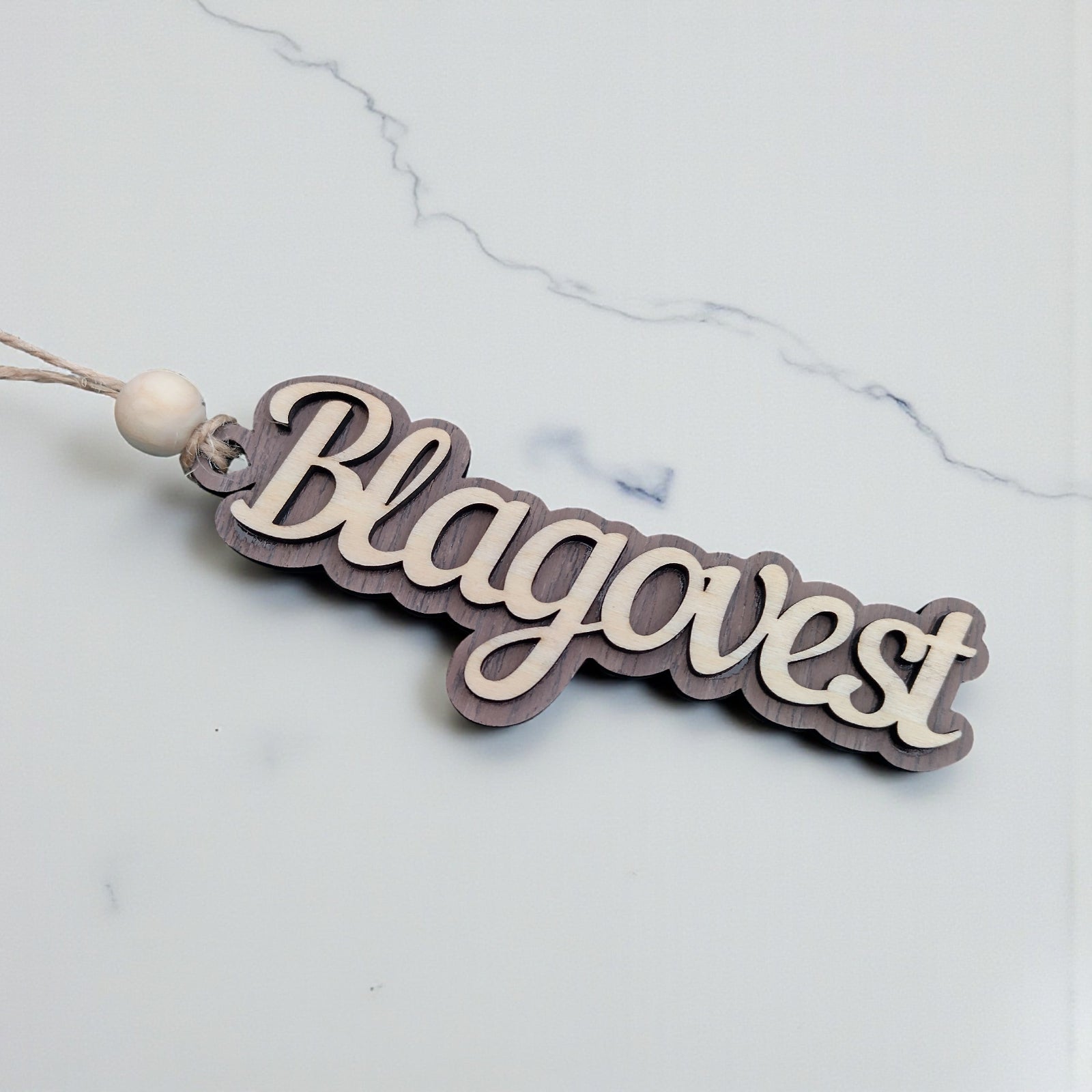 Custom laser cut wooden name decoration on white marble background – personalised gift by CraftRay Gifts