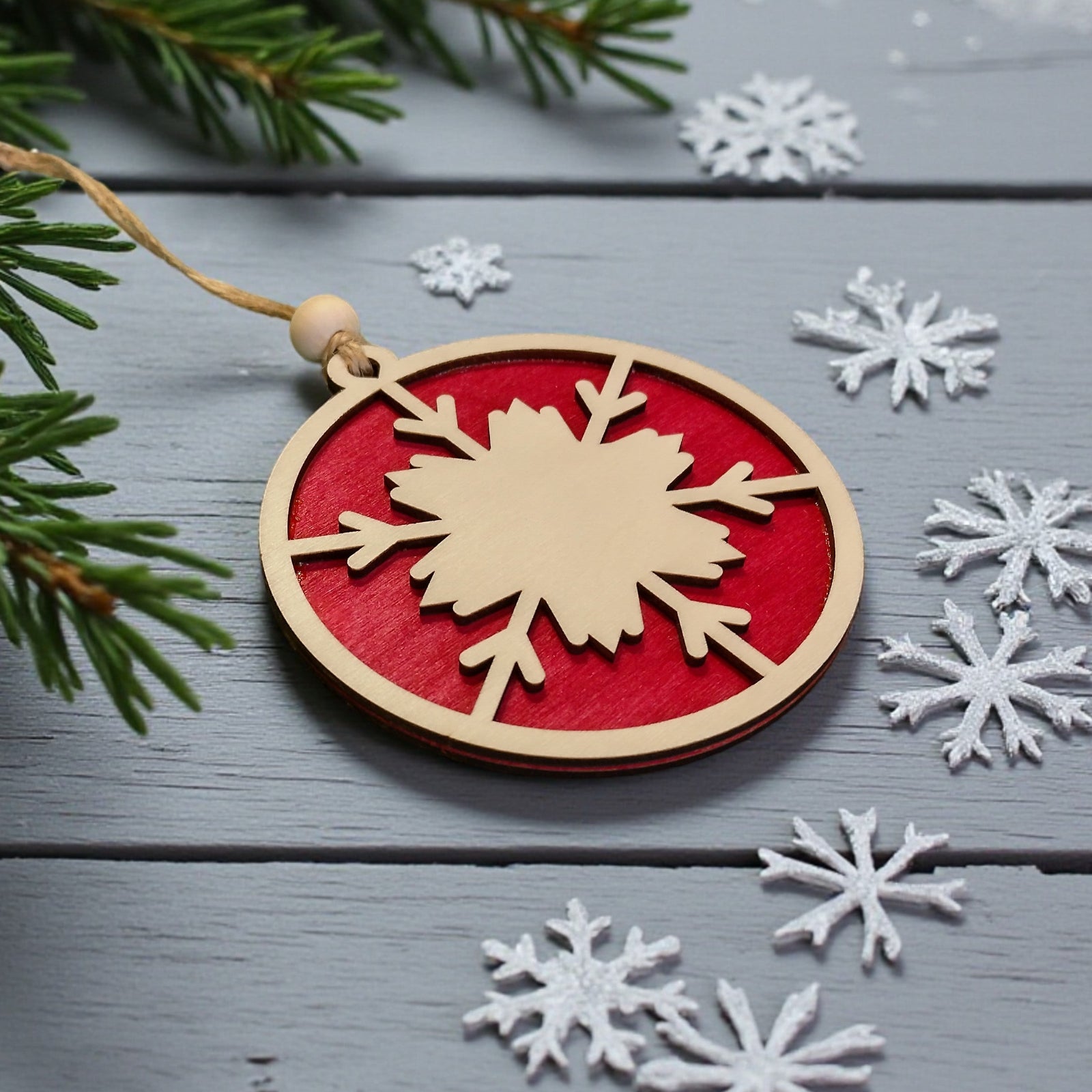 Red snowflake wooden bauble – engraved and layered Christmas ornament by CraftRay Gifts.